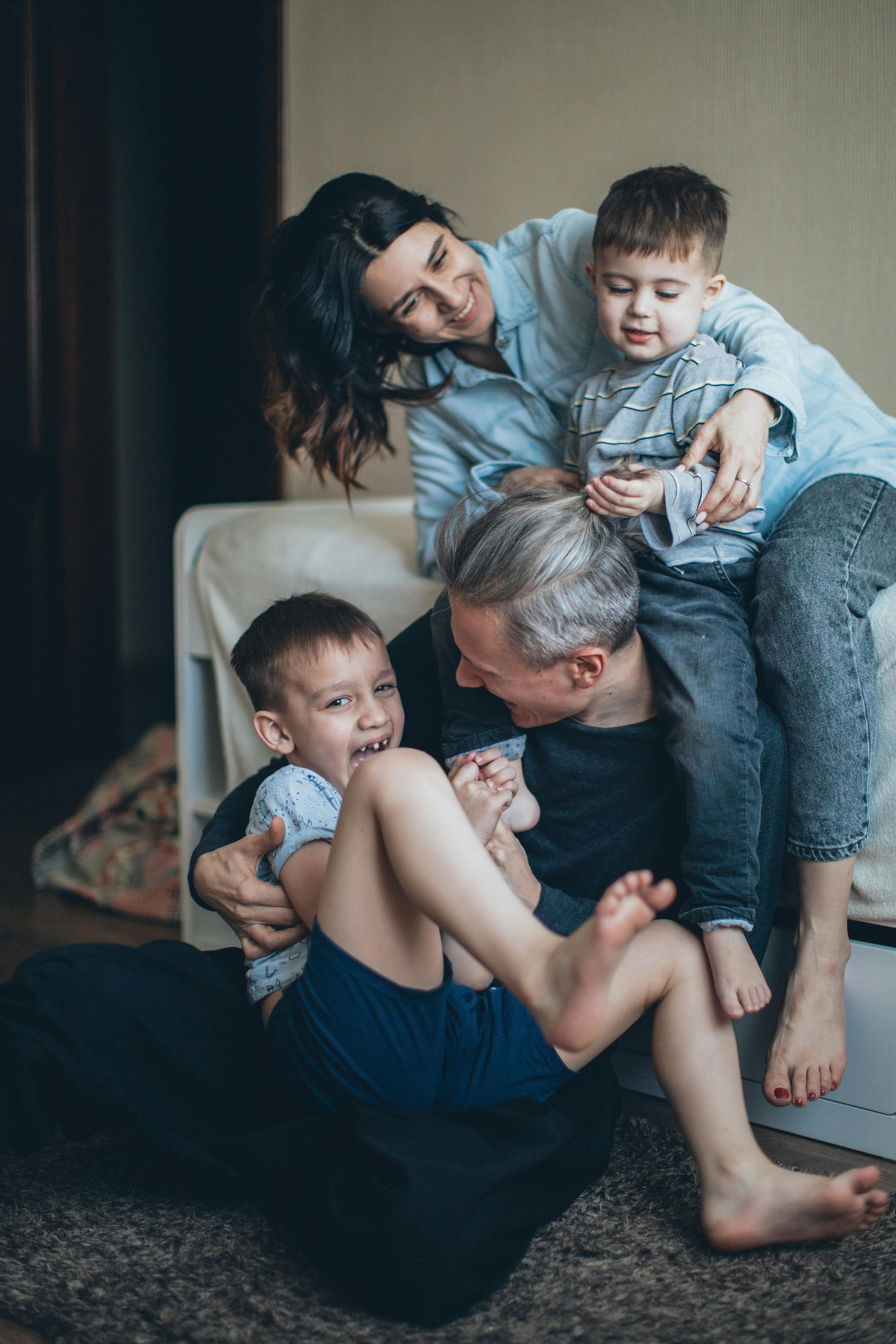 Happy family in front of new home